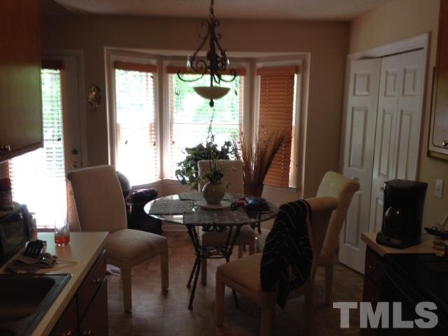 4300 Rockside Hills Drive Raleigh, NC 27603 - Photo 8 of 11 a dining room with furniture and window
