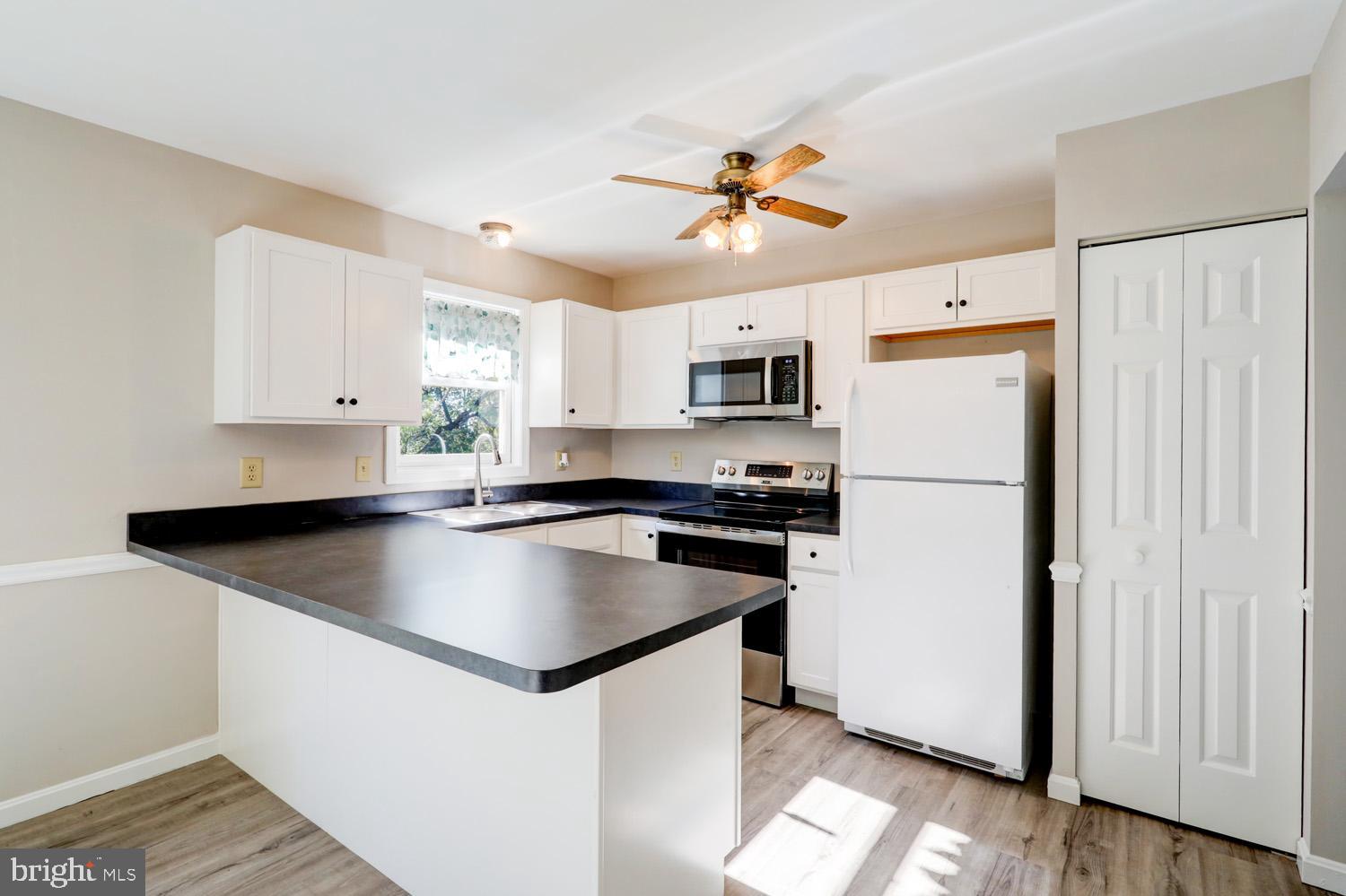 230 Hickory Drive Lititz, PA 17543 - Photo 21 of 43 a kitchen with kitchen island a white counter top space cabinets and stainless steel appliances