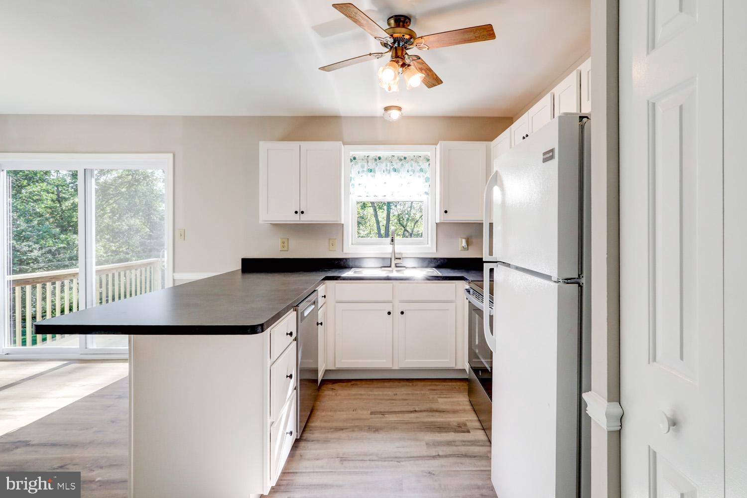 230 Hickory Drive Lititz, PA 17543 - Photo 23 of 43 a kitchen with a refrigerator a sink and a window