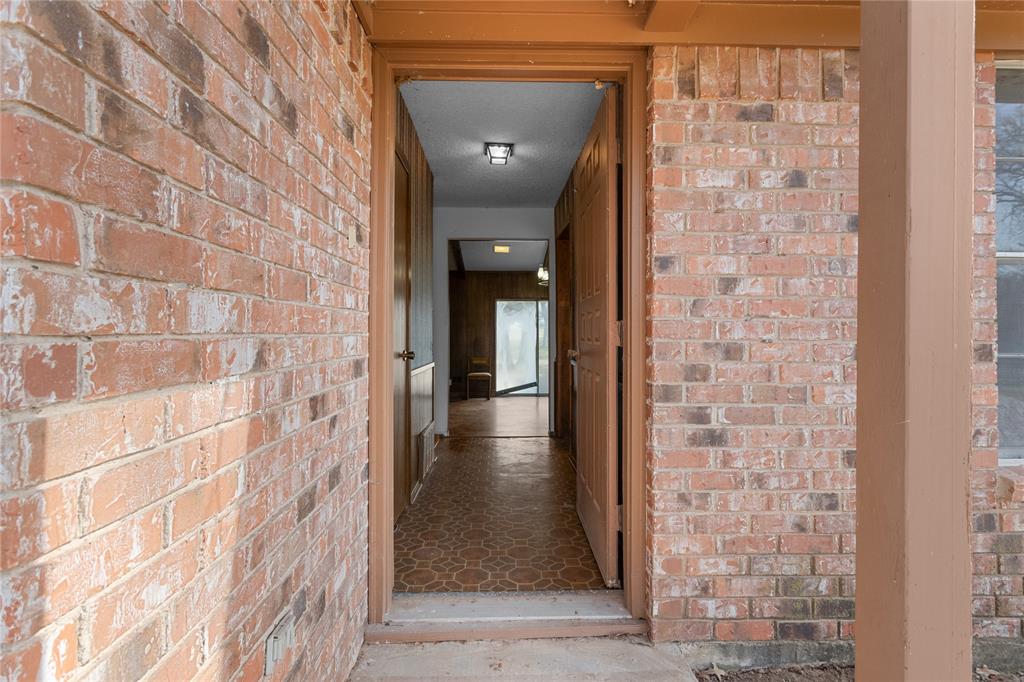 1447 Red Gate Road Mart, TX 76664 - Photo 24 of 38 a view of a hallway with a door