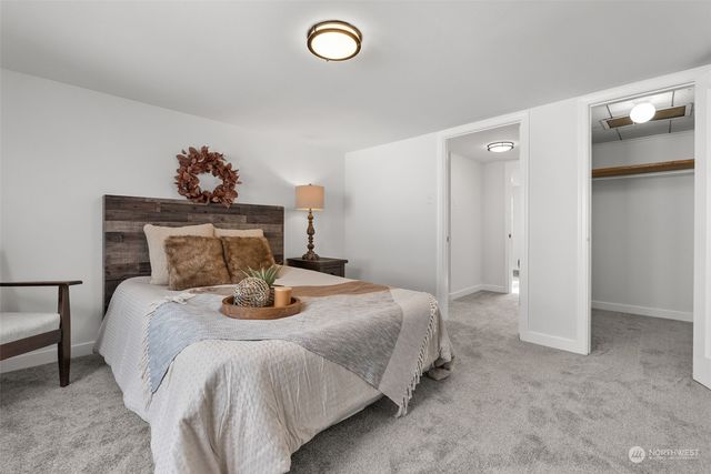 a bedroom with a bed and a table