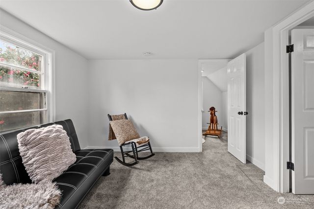 a room with furniture and a window