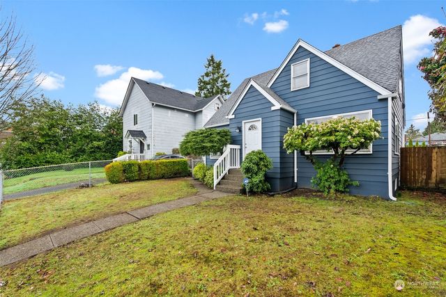 front view of a house with a yard