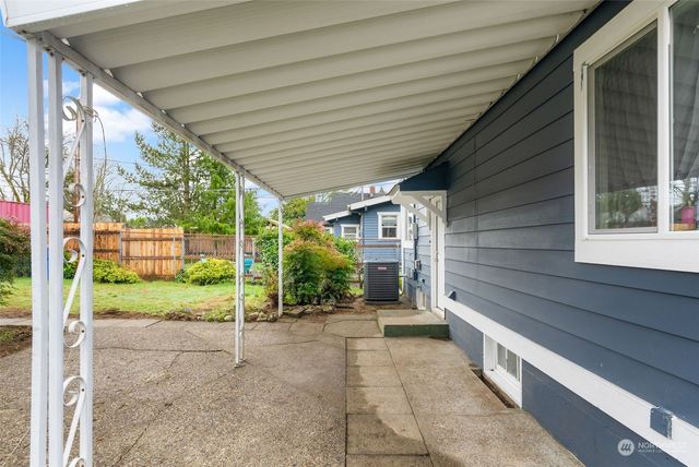 a view of a porch with wooden floor and stairs