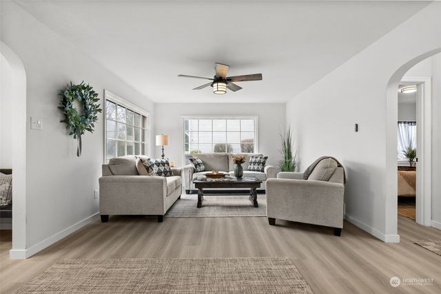 a living room with furniture and a large window