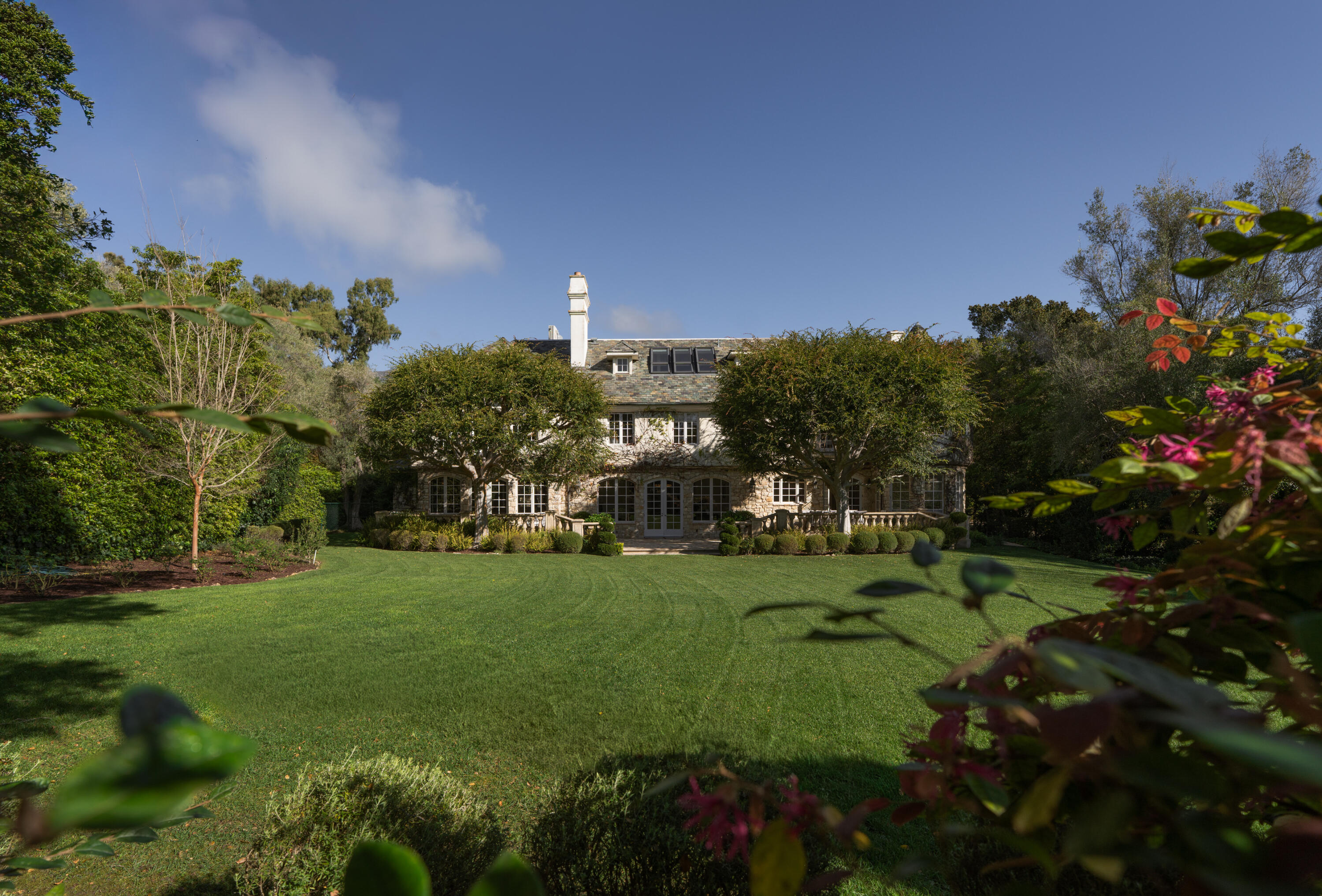 1567 East Valley Road Montecito, CA 93108 - Photo 26 of 34 a view of a house with a yard and garden