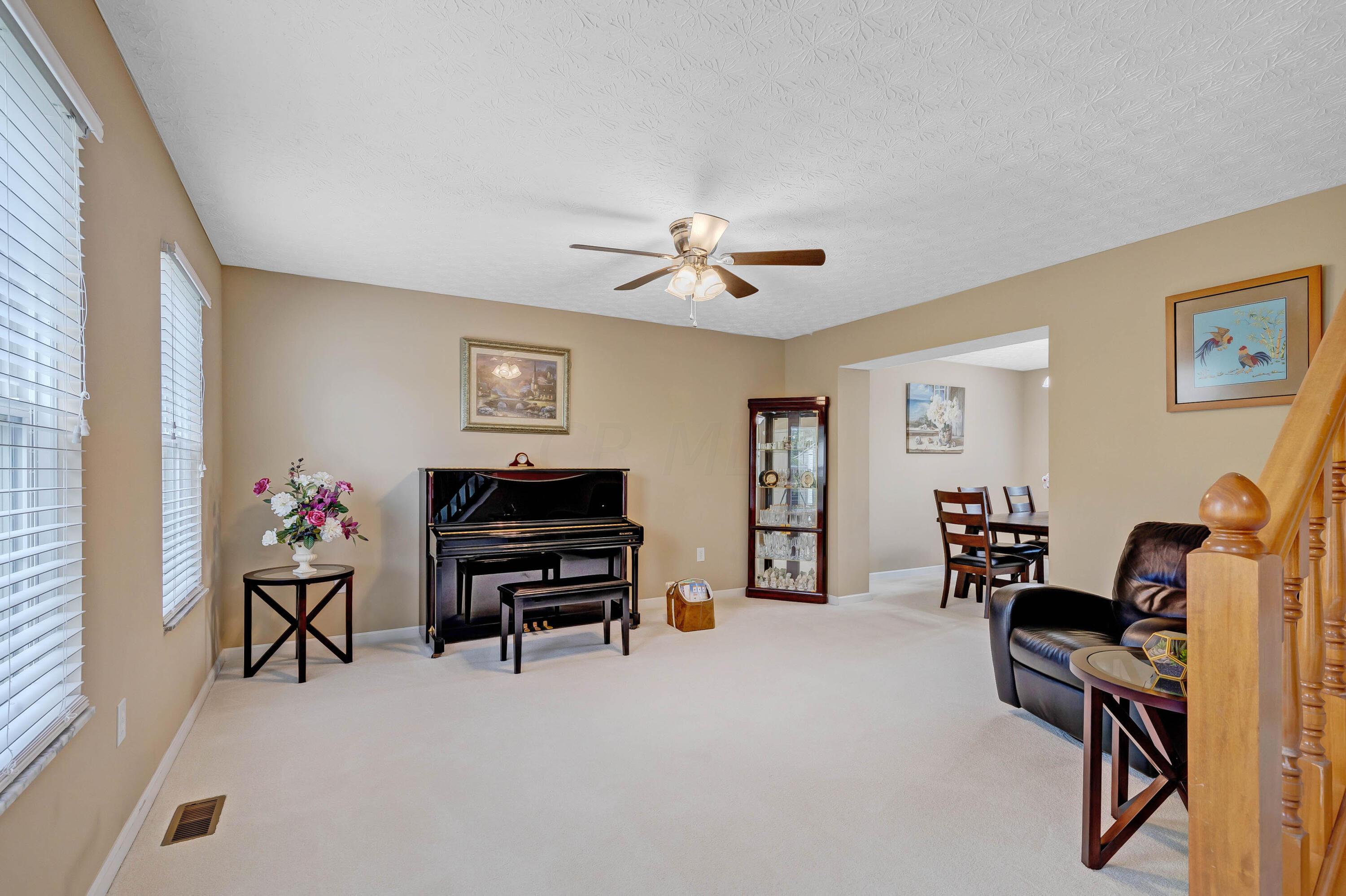 2136 Reeves Avenue Lewis Center, OH 43035 - Photo 6 of 57 • New light sand carpet ~ 2018 • Tan painted walls • New lighted ceiling fan ~ 2018 • 2” blinds