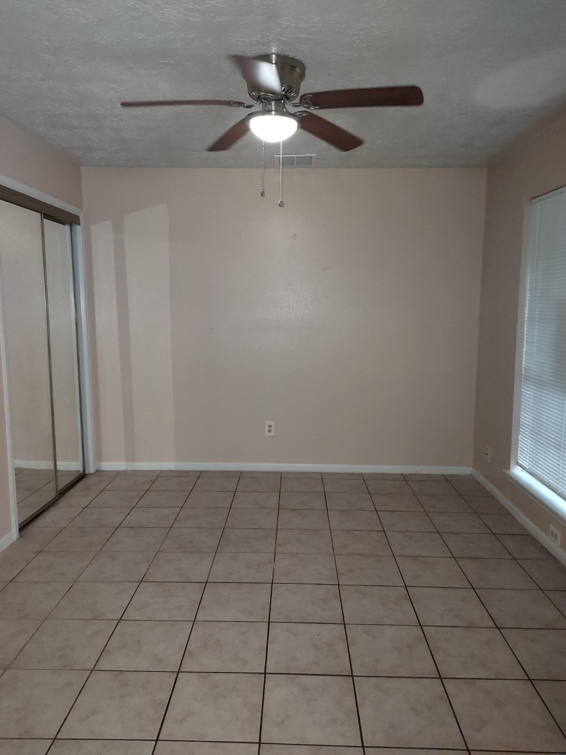 13433 Castilian Drive, Unit 1 Houston, TX 77015 - Photo 5 of 10 a view of an empty room with a window