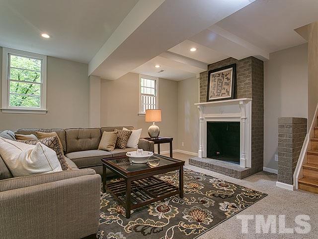 3918 Hope Valley Road Durham, NC 27707 - Photo 4 of 25 Lower level has large area for entertaining along with cozy fireplace.