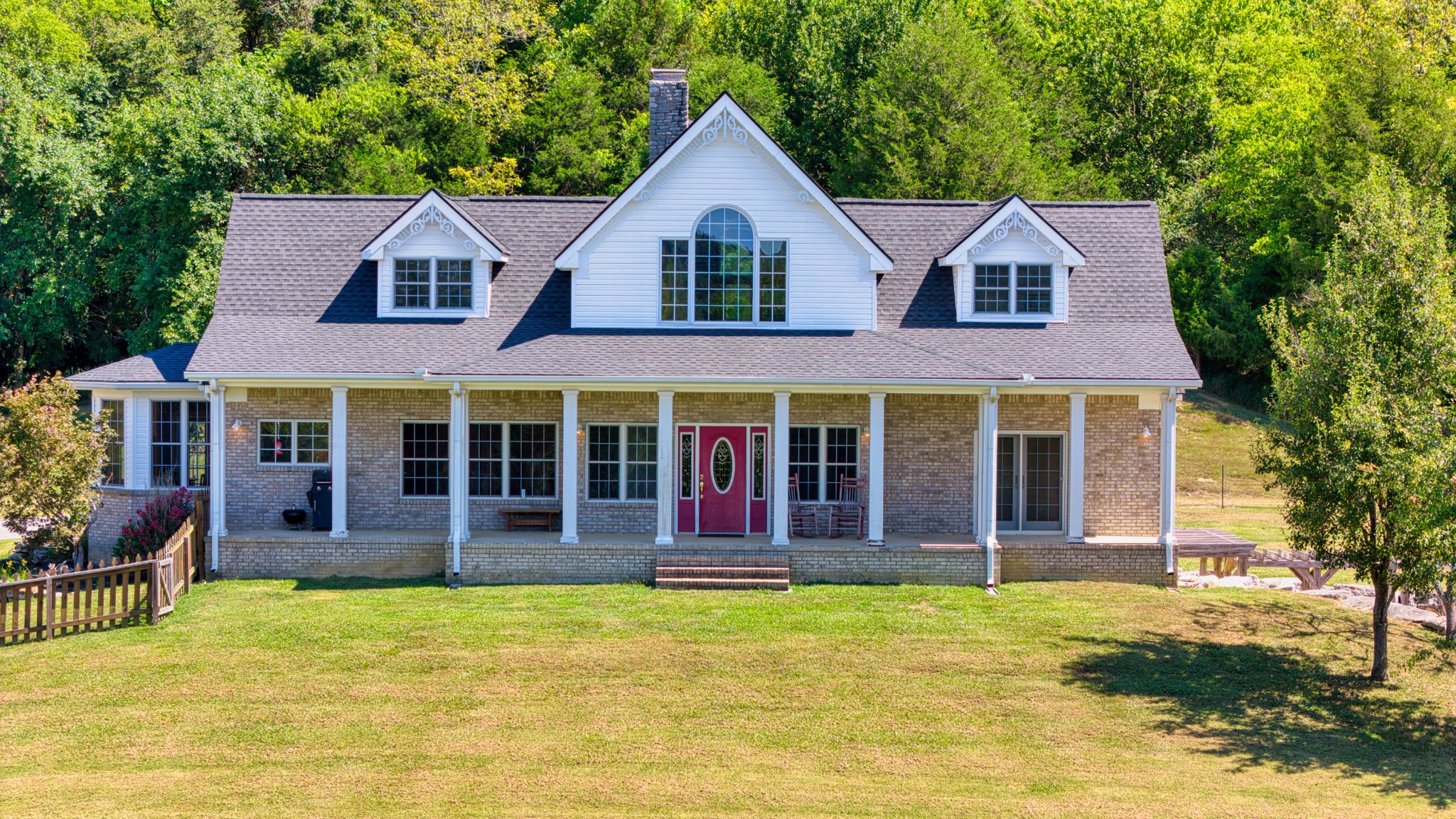 front view of a house with a yard