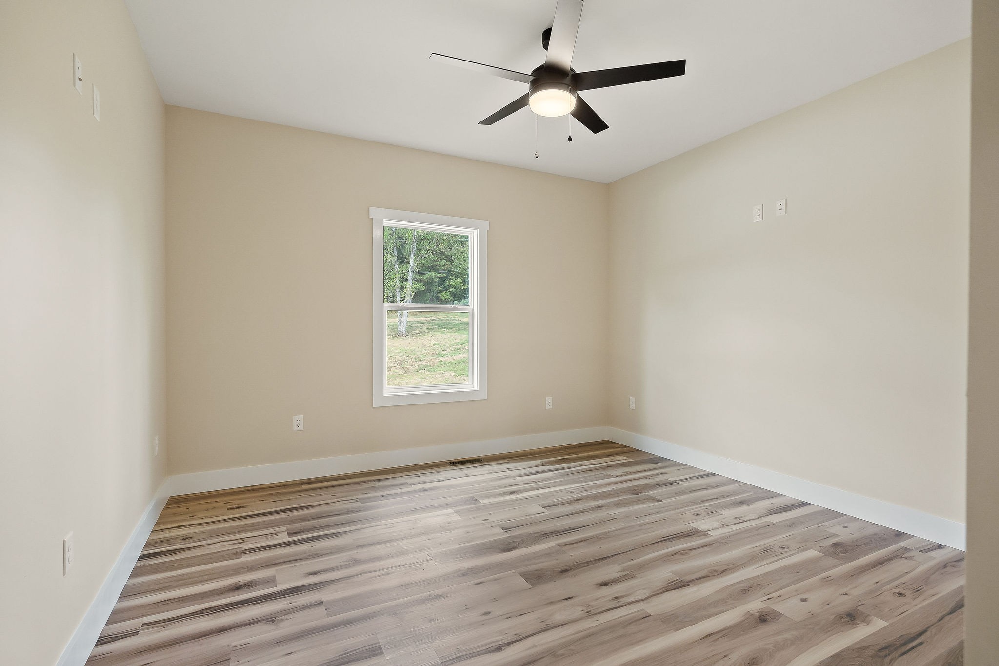 6544 Thomas Twin Oaks Road Baxter, TN 38544 - Photo 16 of 32 wooden floor in an empty room with a window