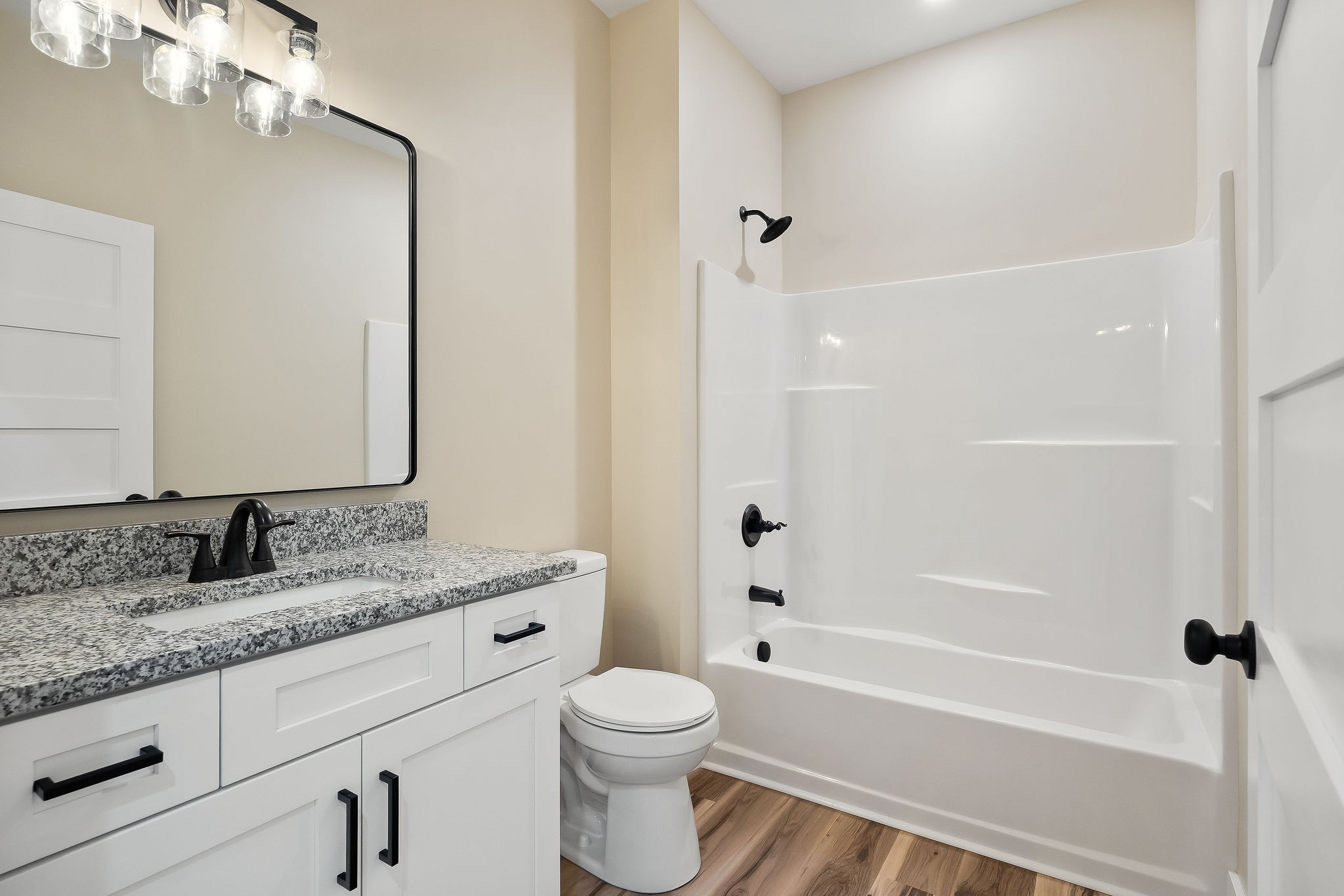 6544 Thomas Twin Oaks Road Baxter, TN 38544 - Photo 18 of 32 a bathroom with a granite countertop sink toilet and shower