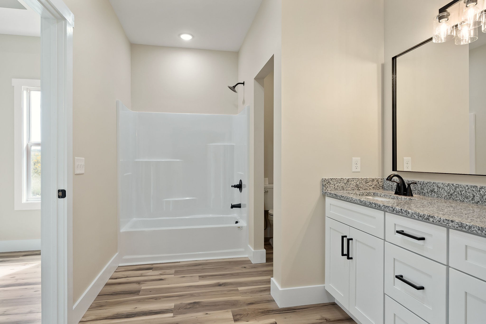 6544 Thomas Twin Oaks Road Baxter, TN 38544 - Photo 19 of 32 a bathroom with a granite countertop sink and a mirror