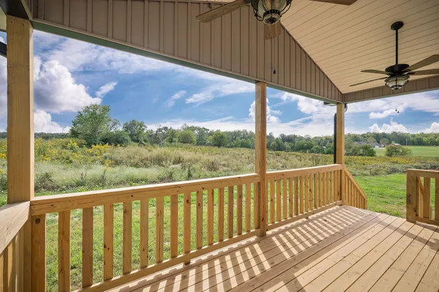 a view of a two chairs in the balcony