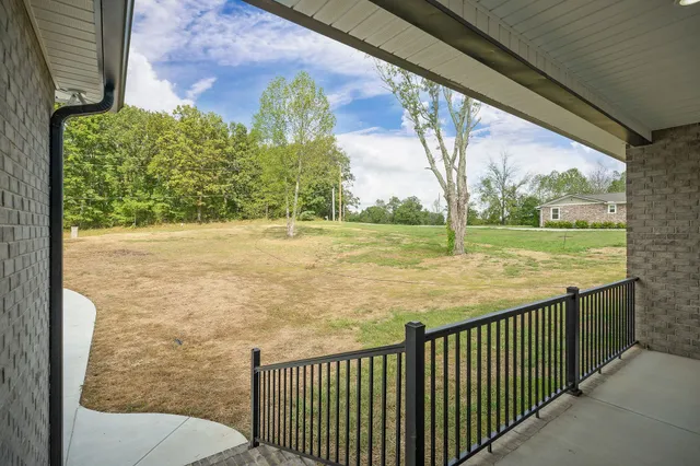 a view of a garden from a balcony