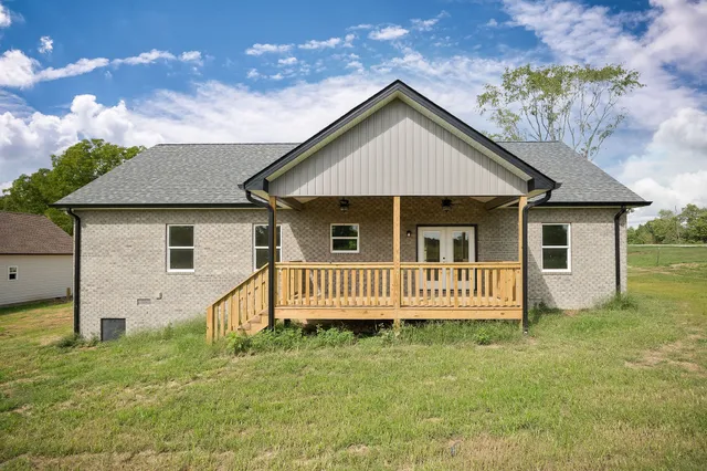 front view of a house with a yard