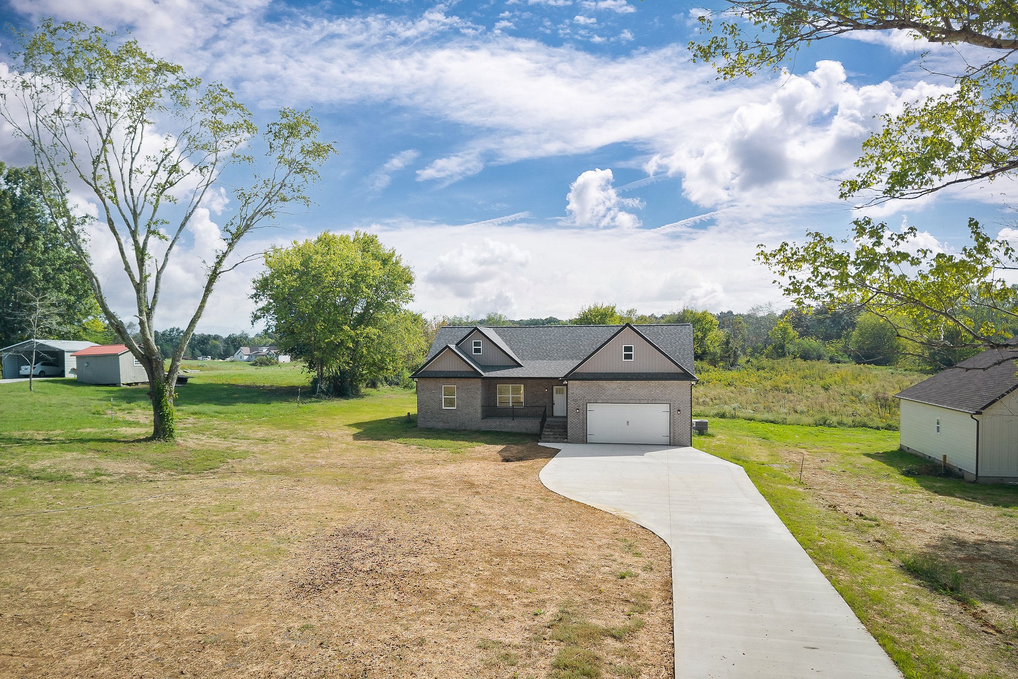 6544 Thomas Twin Oaks Road Baxter, TN 38544 - Photo 29 of 32 a front view of a house with garden