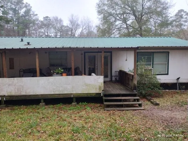 a view of a backyard with a sitting area and slide