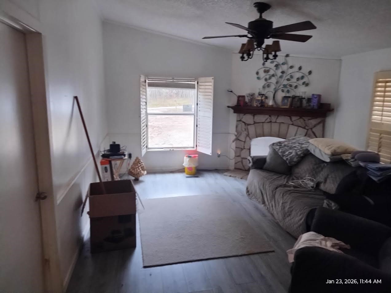 180 Woods Road Coldspring, TX 77331 - Photo 13 of 35 a bed room with furniture and a chandelier