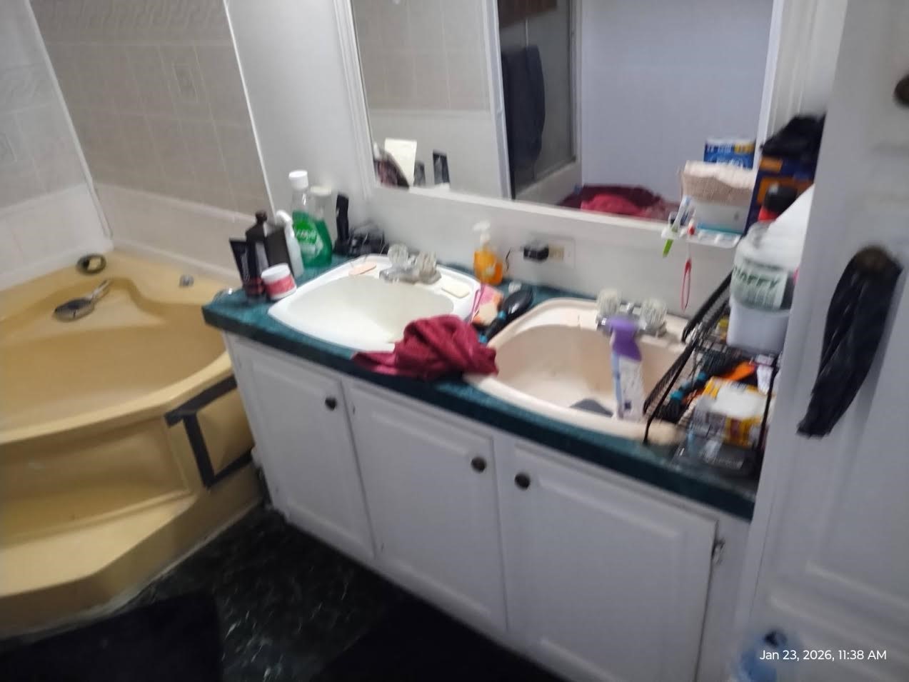 180 Woods Road Coldspring, TX 77331 - Photo 17 of 35 a bathroom with a sink and a mirror