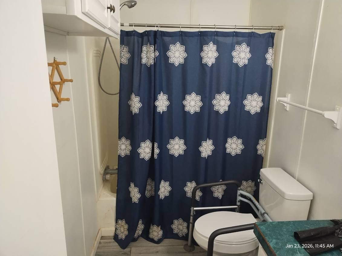 180 Woods Road Coldspring, TX 77331 - Photo 20 of 35 a bathroom with a toilet sink and shower