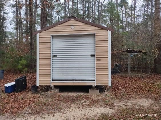 180 Woods Road Coldspring, TX 77331 - Photo 29 of 35 a front view of a house with a yard