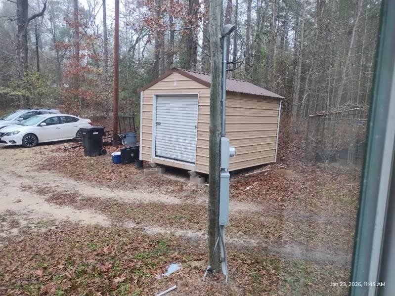 180 Woods Road Coldspring, TX 77331 - Photo 30 of 35 a view of a house with a yard