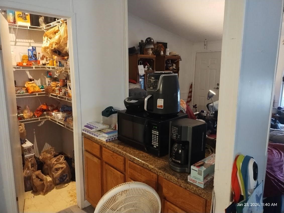 180 Woods Road Coldspring, TX 77331 - Photo 4 of 35 a view of a workspace with furniture and closet