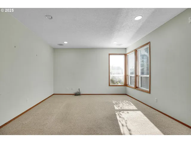 a living room with furniture and a table with wooden floor
