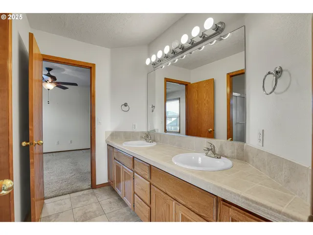 a bathroom with a toilet sink and shower