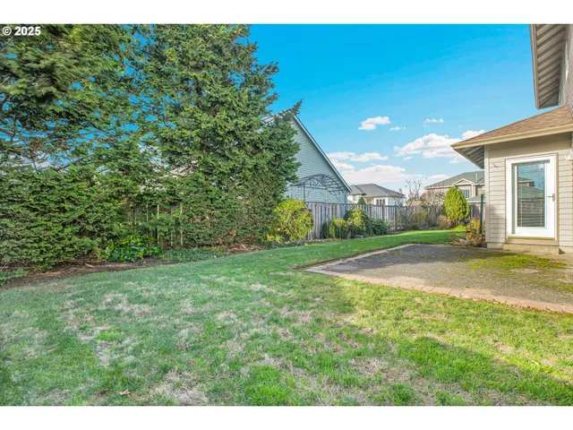 a view of a house with a yard and garage