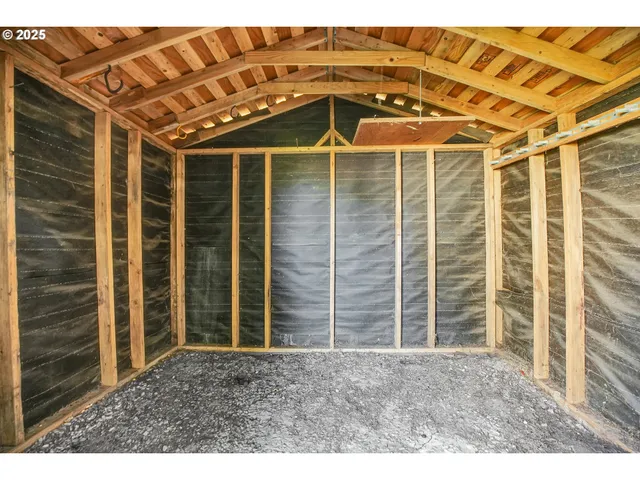 a large kitchen with granite countertop a large window and a counter space