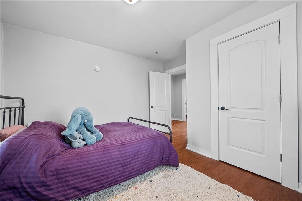 449 Elwyn Avenue Springdale, PA 15144 - Photo 35 of 46 a bedroom with a bed and hallway