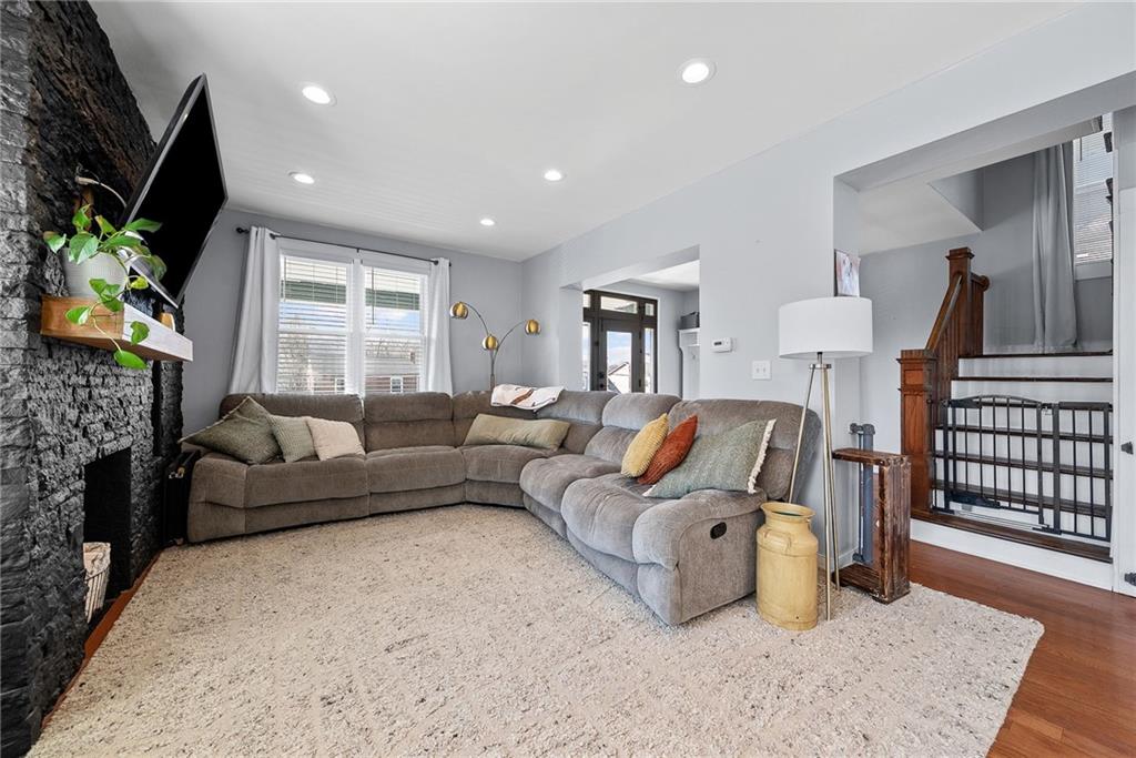 449 Elwyn Avenue Springdale, PA 15144 - Photo 10 of 46 a living room with furniture and a flat screen tv