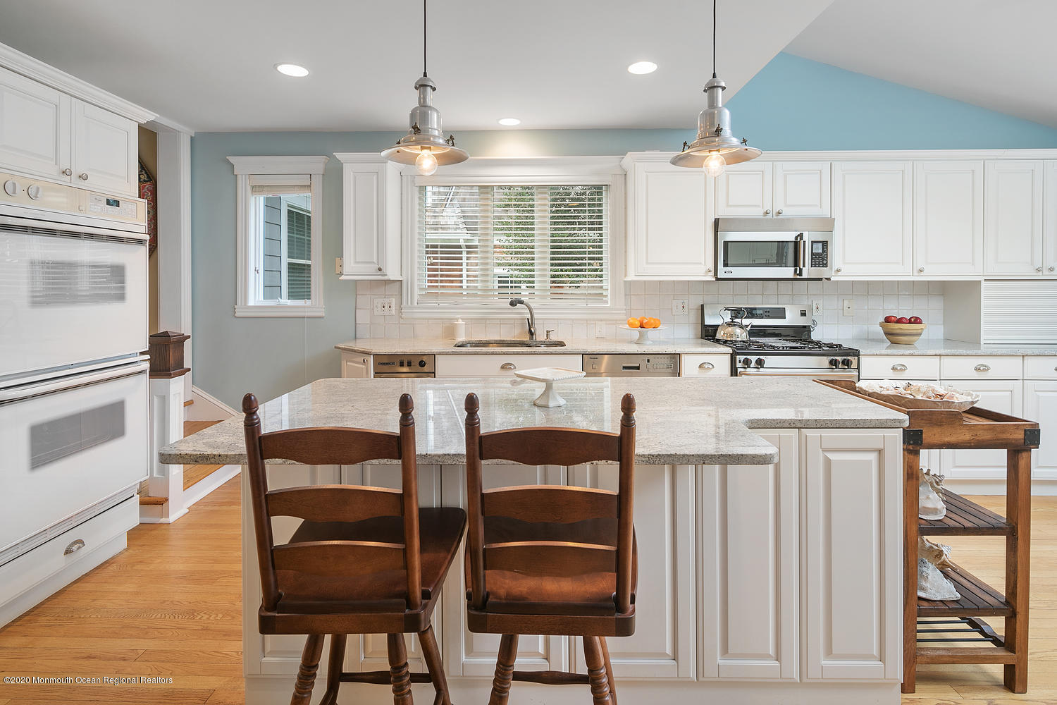 408 Tuttle Avenue Spring Lake, NJ 07762 - Photo 14 of 36 a kitchen with stainless steel appliances granite countertop a stove a sink dishwasher and a refrigerator with wooden floor