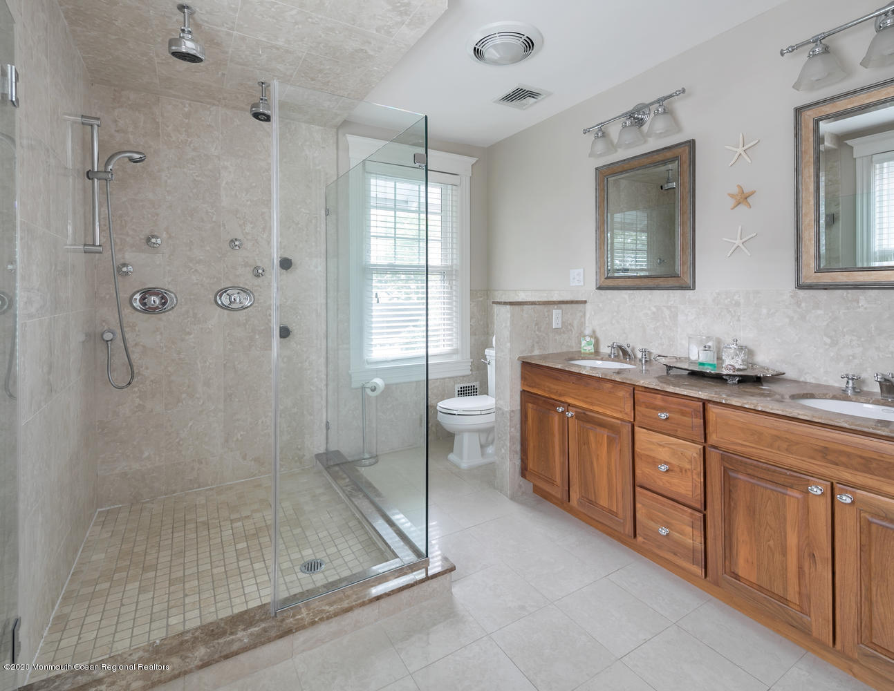 408 Tuttle Avenue Spring Lake, NJ 07762 - Photo 22 of 36 a spacious bathroom with a granite countertop sink mirror and shower