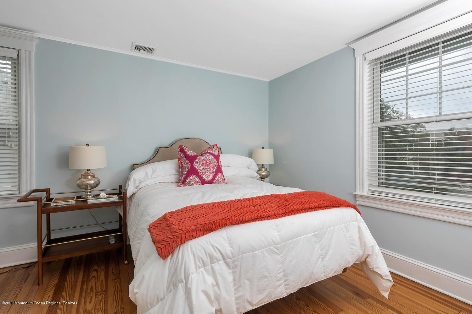 408 Tuttle Avenue Spring Lake, NJ 07762 - Photo 26 of 36 a bedroom with a bed and wooden floor