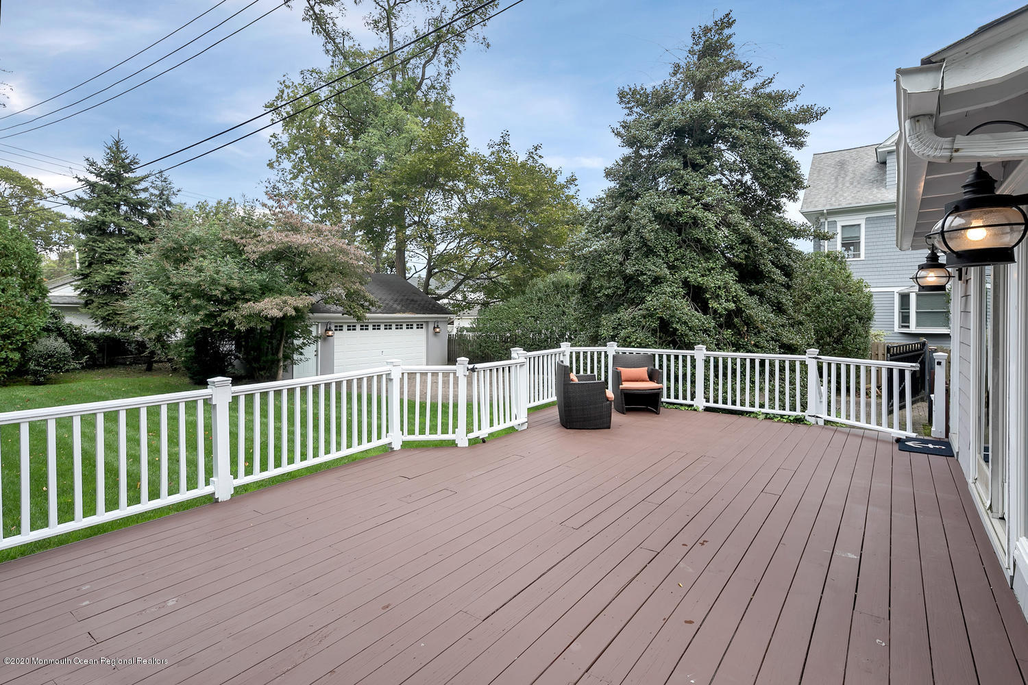 408 Tuttle Avenue Spring Lake, NJ 07762 - Photo 33 of 36 a balcony with wooden floor and fence