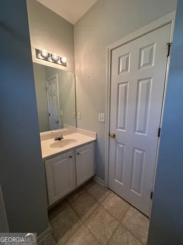 a bathroom with a sink and mirror