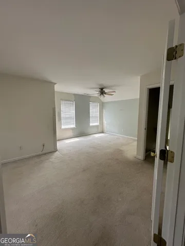 a view of empty room with a fireplace