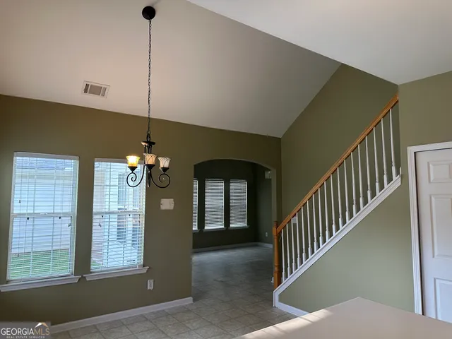 a view of a livingroom with a staircase