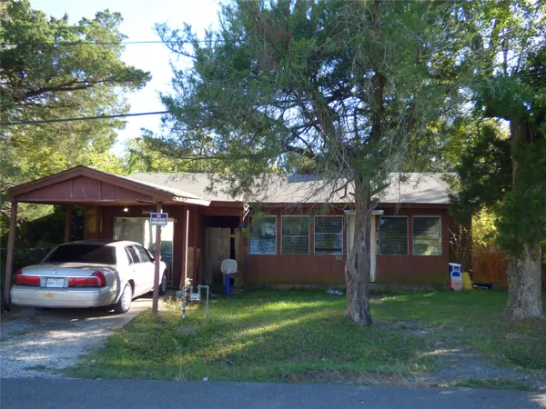 a view of a house with a garden