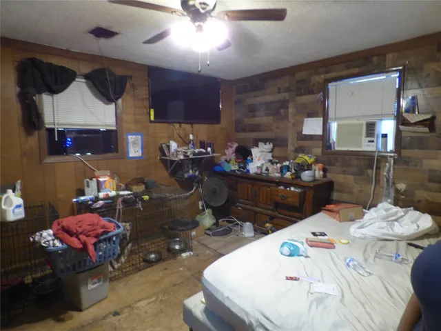 a view of a backyard with plants and a patio