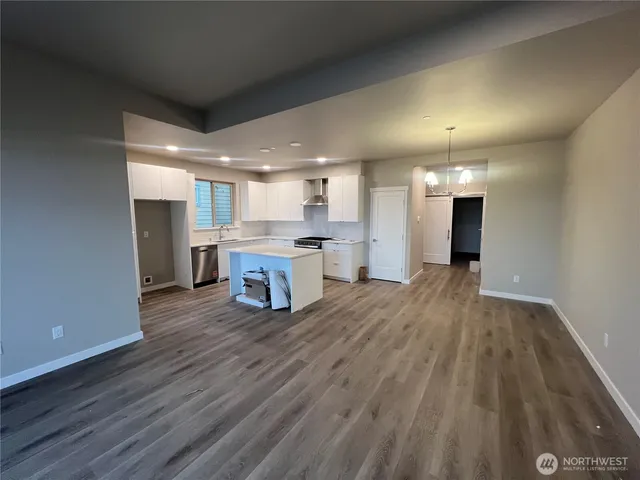 a view of kitchen with wooden floor