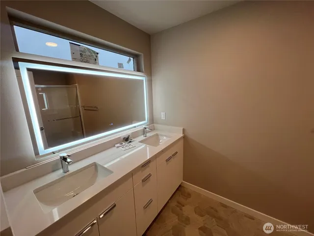 a bathroom with a sink and a mirror