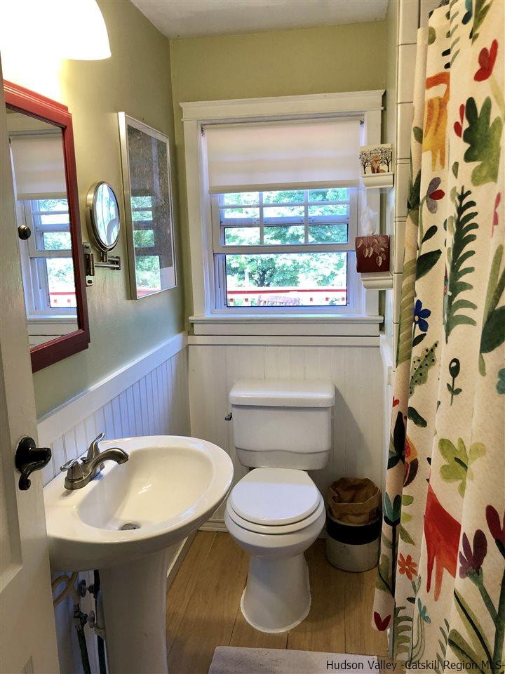 160 Old Rte 209 Hurley, NY 12443 - Photo 19 of 29 a bathroom with a toilet sink and mirror