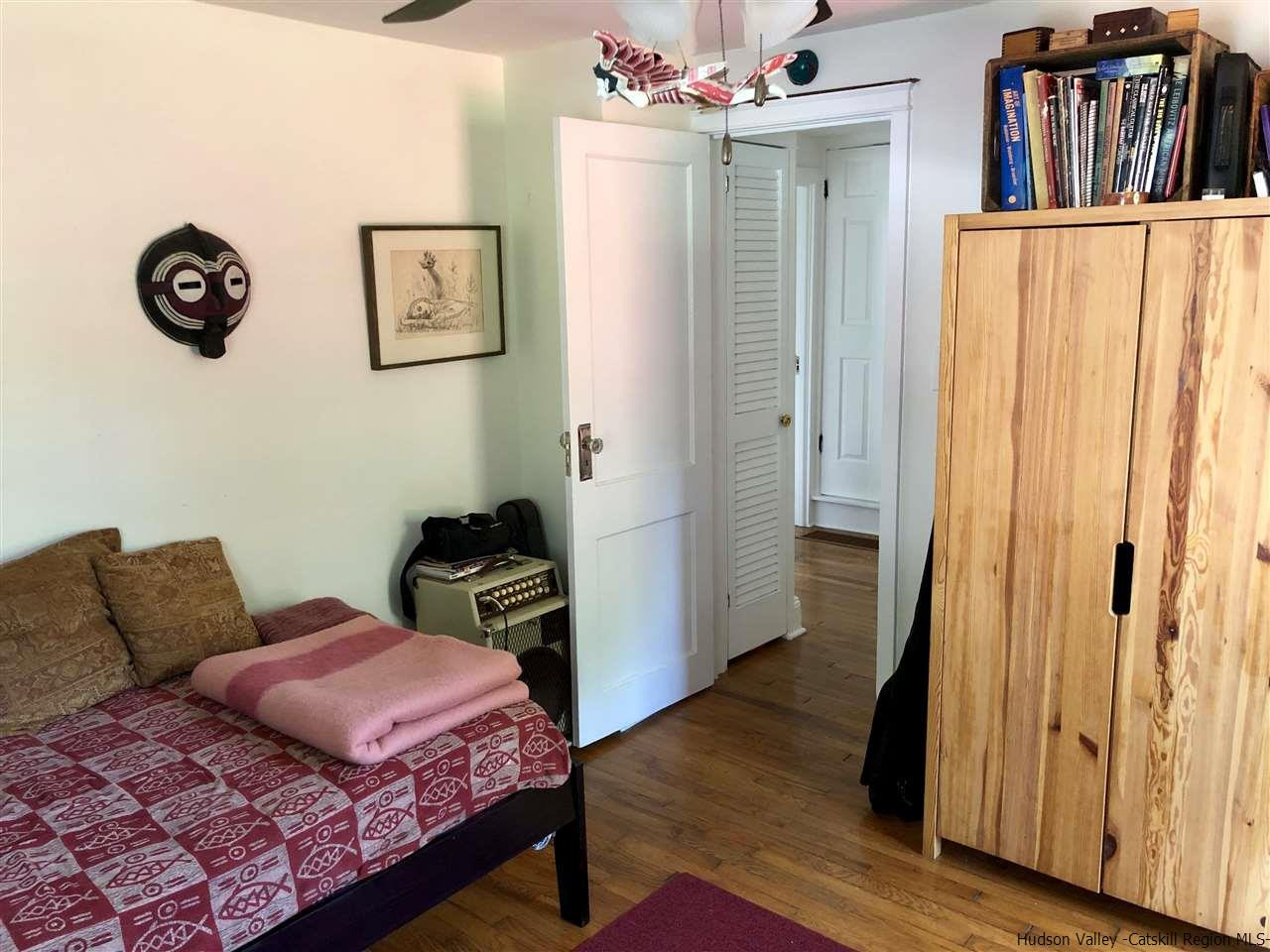 160 Old Rte 209 Hurley, NY 12443 - Photo 21 of 29 a bedroom with furniture and wooden floor