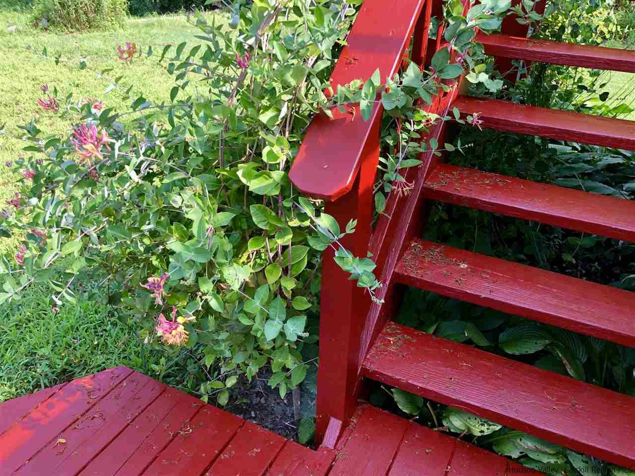 160 Old Rte 209 Hurley, NY 12443 - Photo 4 of 29 a view of a yard with plants and wooden fence