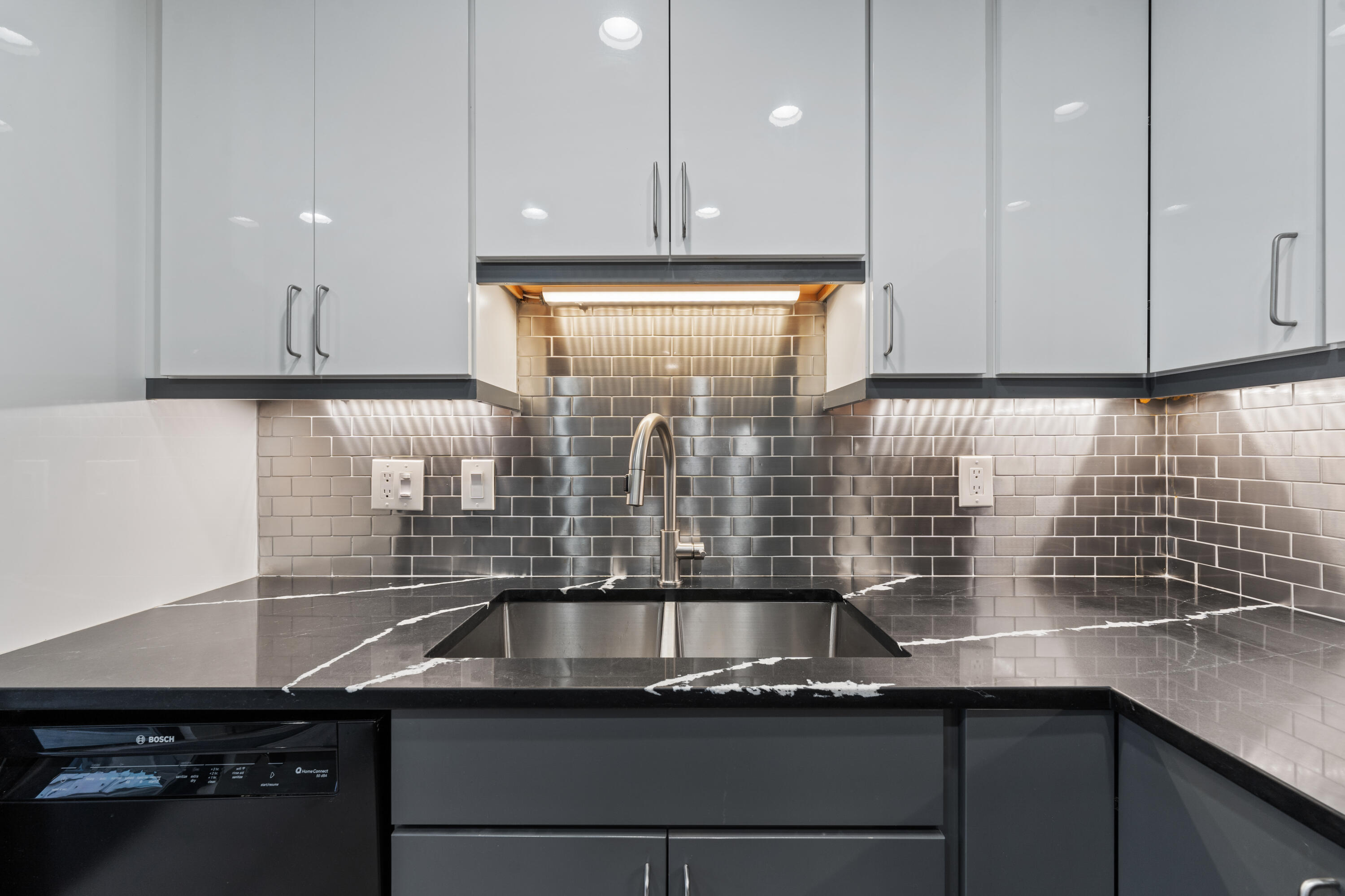 a kitchen with a sink and cabinets
