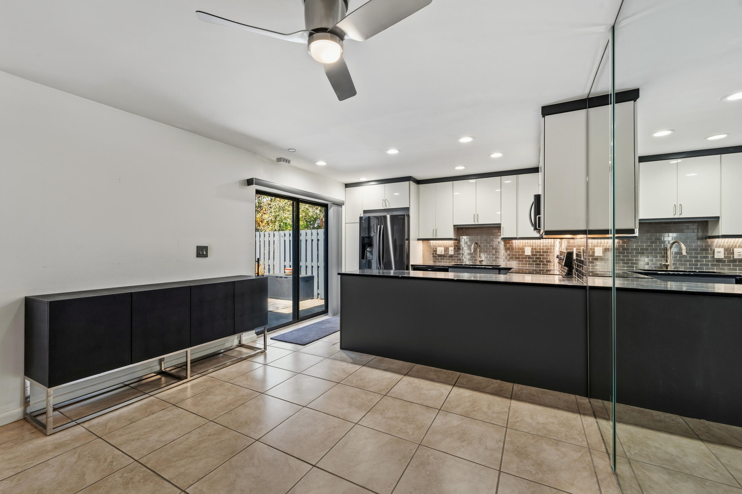 3852 Jefferson Street Stuart, FL 34997 - Photo 12 of 42 a kitchen with stainless steel appliances granite countertop a refrigerator and a sink